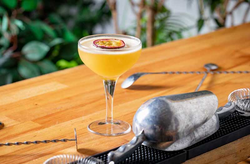Fresh cocktail sat on a bar top