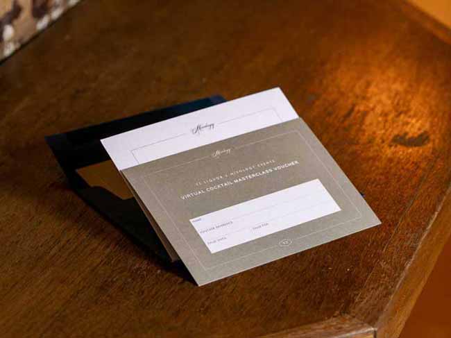 Open cocktail voucher on a table top